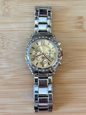 Silver Tone Crystal Accent Watch with Champagne Dial and Gold Accents